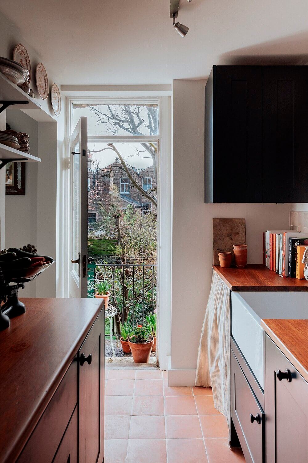 The Small London Apartment Of An Antiques Dealer 11 SmallBlueKitchenWithGardenViewsinaTinyLondonApartment TheNordroom8 The Small London Apartment Of An Antiques Dealer
