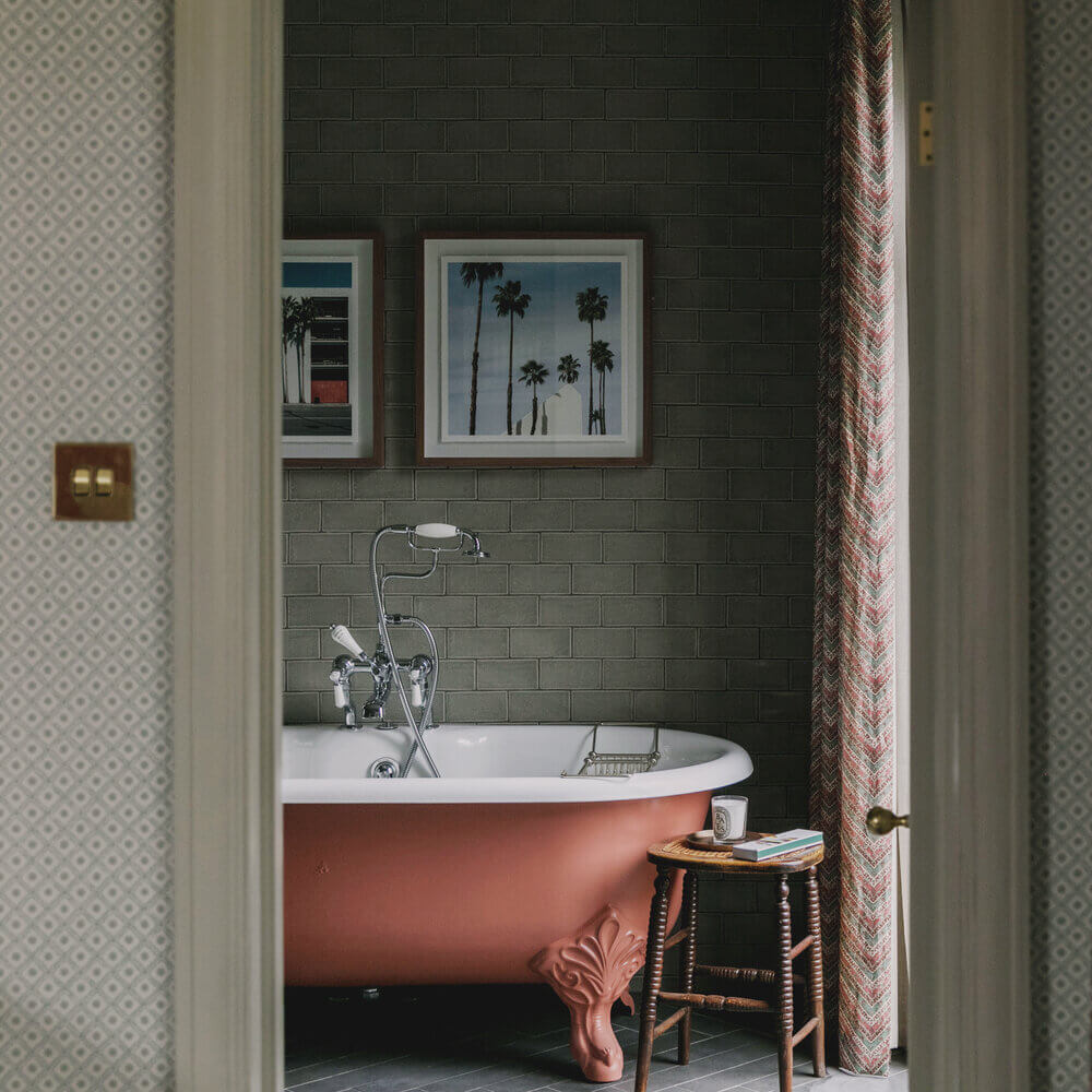 Warm Colors and Texture In A North London Family Home 13 bathroom-pink-clawfoot-bath-studio-duggan
