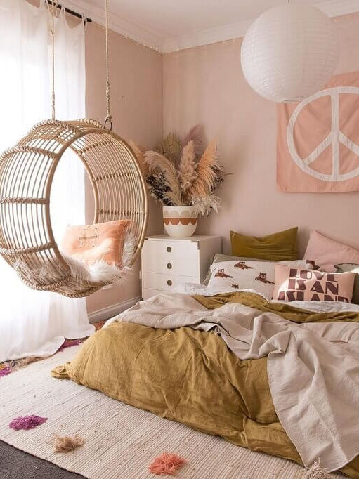 How To Style A Pink Bedroom (For Adults) 35 bedroom-pink-walls-rattan-hanging-chair-nordroom