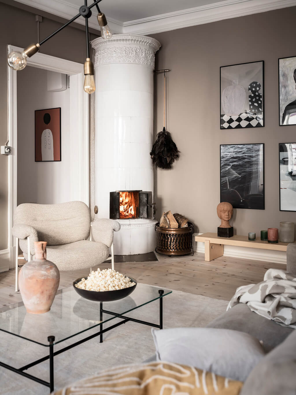 A Stylish Gray Scandinavian Apartment 1 grey-living-room-fireplace-gallery-wall-nordroom