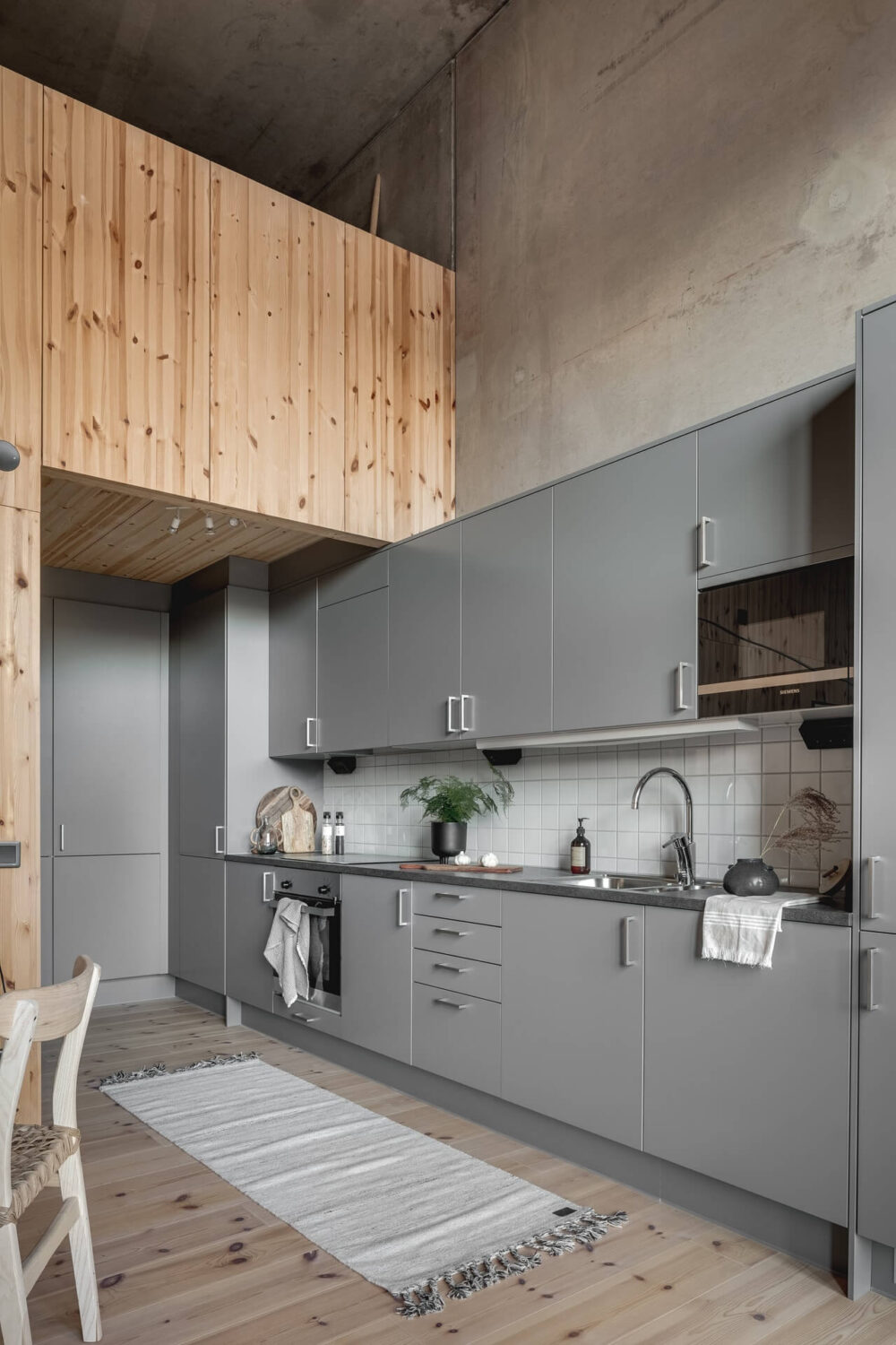 A Scandinavian Loft Made of Concrete and Wood 8 grey-loft-kitchen-scandinavian-design-nordroom