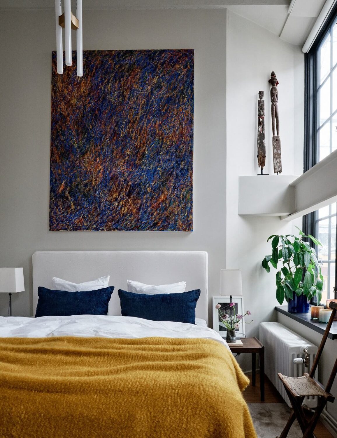 An Art-Filled Apartment in Stockholm 7 bedroom-colorful-art-yelow-textiles-scandinavian-design-nordroom