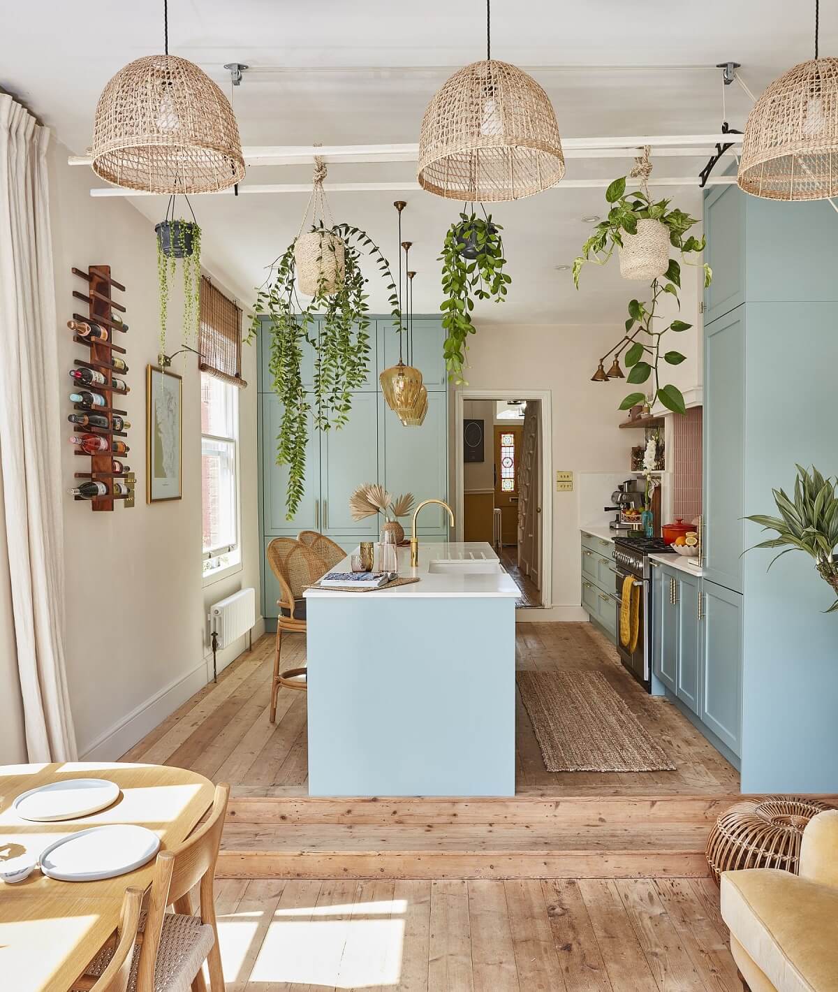 A Colorful 70s Inspired Home in London 1 light-blue-kitchen-hanging-plants-70s-inspired-home-nordroom