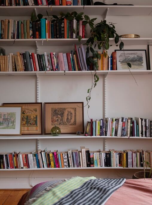 A Pink Studio Apartment with Bookshelves 2 bookshelves-studio-nordroom