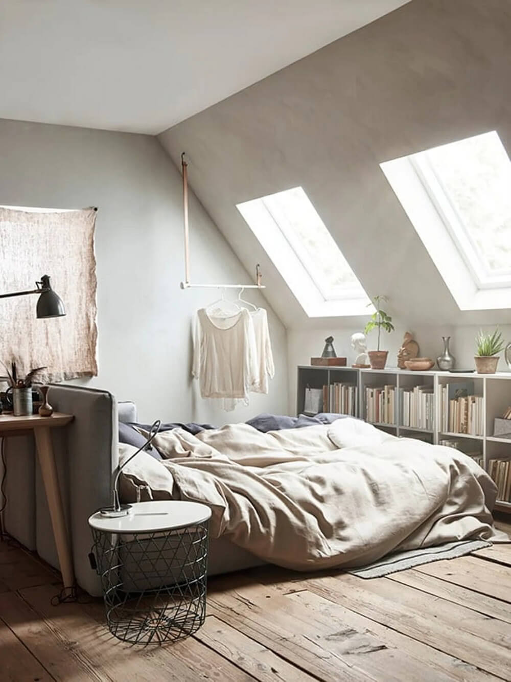 How To Decorate A Bedroom with A Slanted Ceiling 8 ikea-bedroom-bed-center-room-bookshelves-under-slanted-ceiling-nordroom