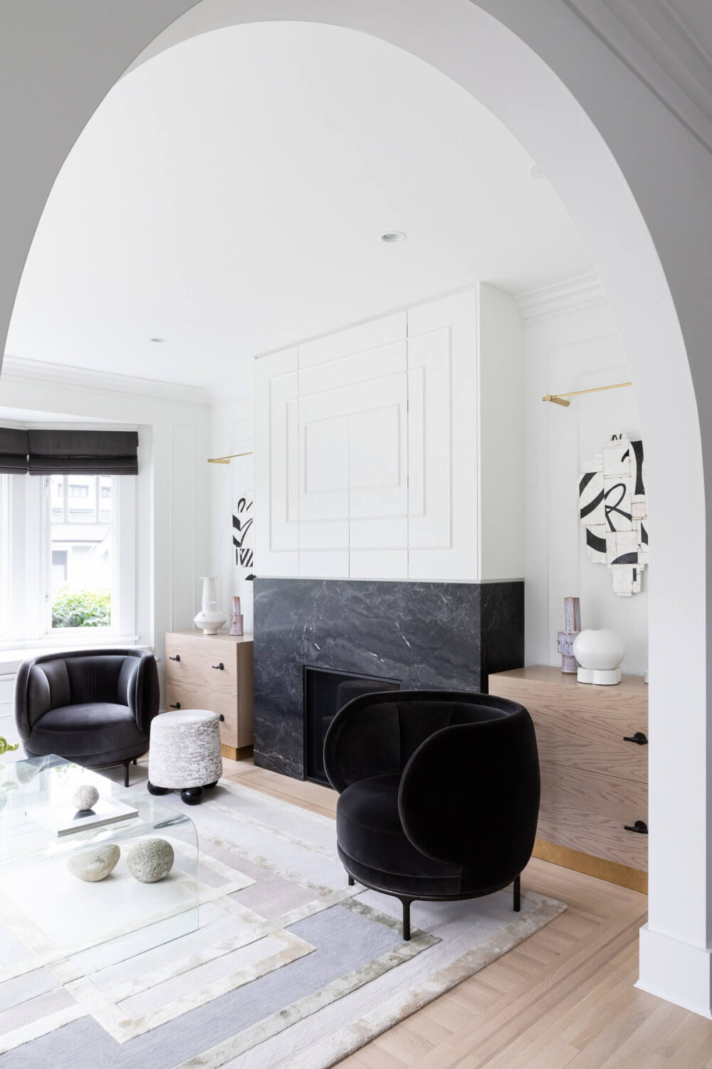 An Eclectic Elegant Home in Vancouver 1 living-room-black-armchairs-black-fireplace-elegant-vancouver-home-gillian-segal-design-nordroom