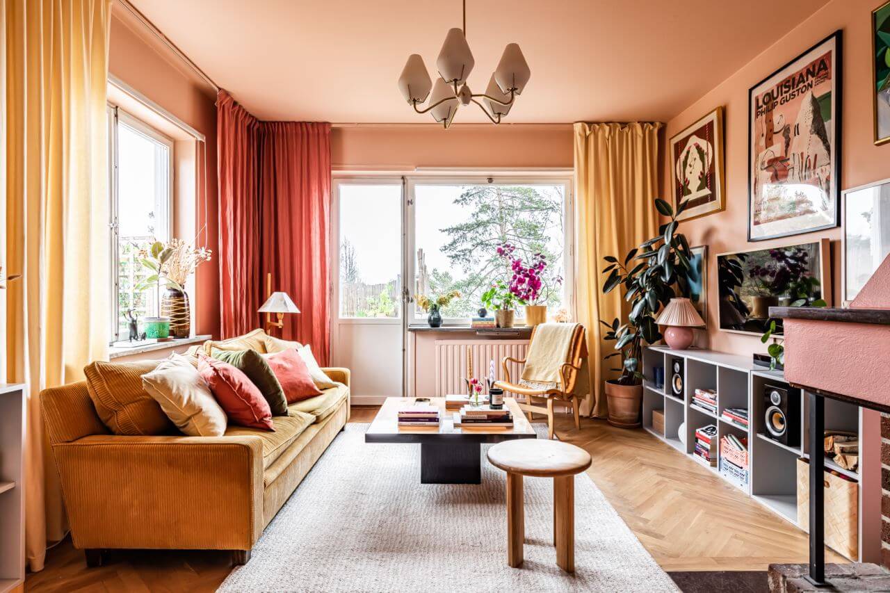 These Colorful Scandinavian Interiors Will Wow You 16 ochre-sofa-pink-living-room-fireplace-nordroom