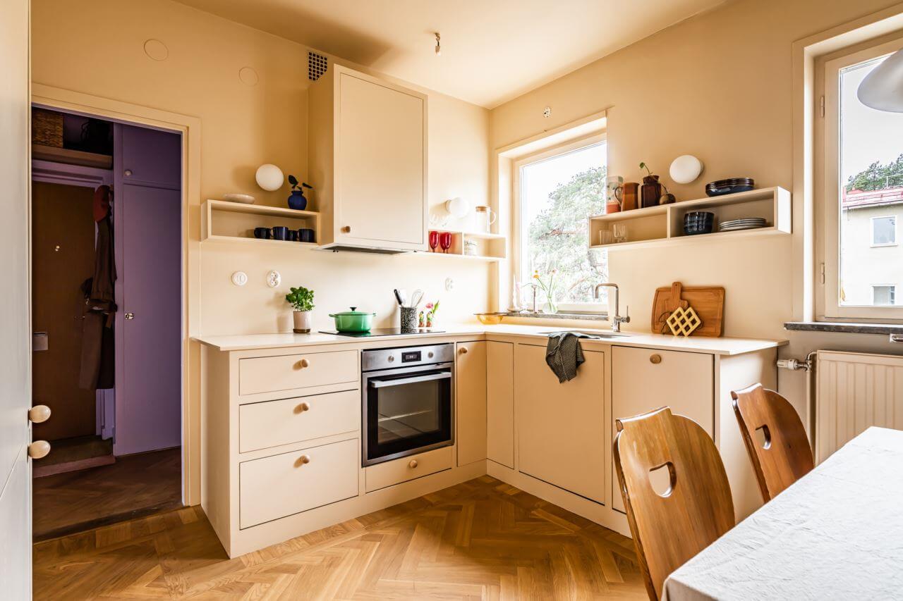These Colorful Scandinavian Interiors Will Wow You 17 pale-yellow-kitchen-cabinets-walls-nordroom