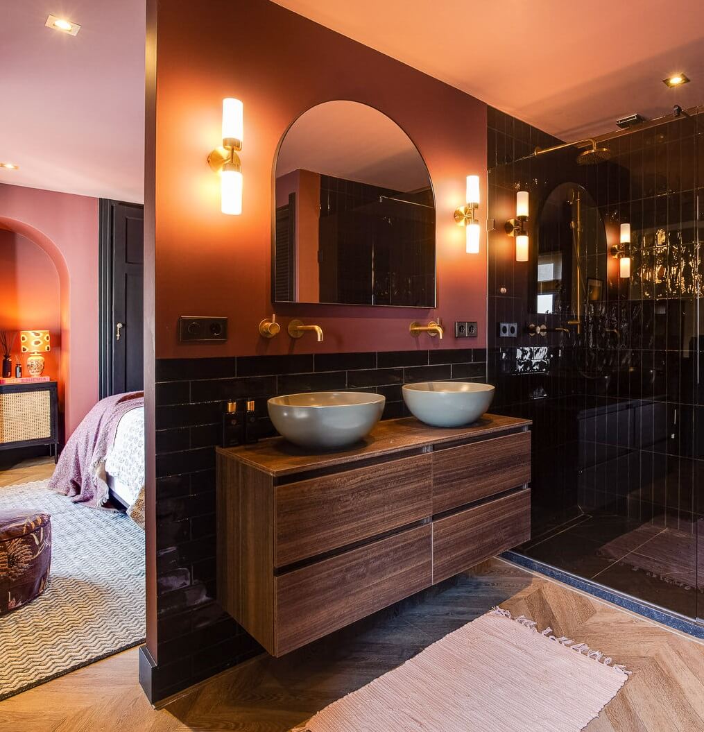 89 Pink Bathroom Ideas: From Hot Pink Walls to Blush Tiles 9 bathroom-black-shower-tiles-pink-walls-wooden-vanity-nordroom