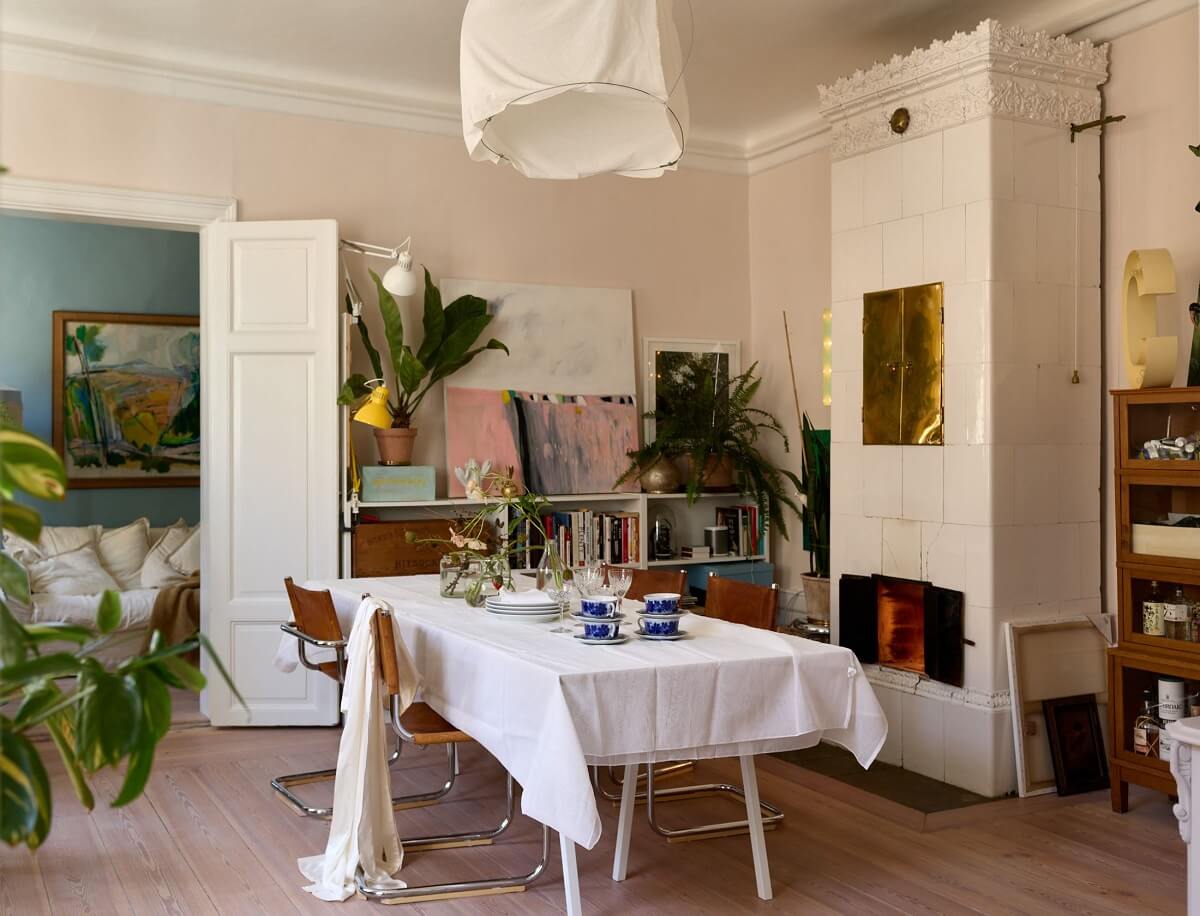 A Cozy Plant-Filled Home in Sweden 1 dining-room-fireplace-kakelugn-nordroom
