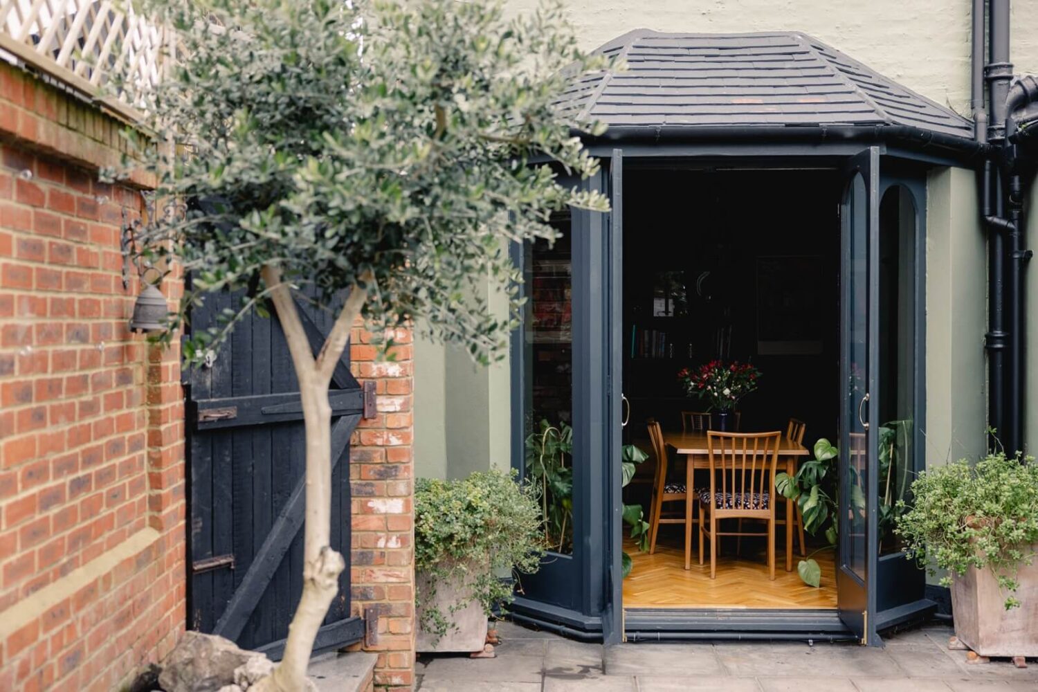 A Green Kitchen with Pink Ceiling in a Colorful London Home 10 garden-exterior-edwardian-home-london-nordroom