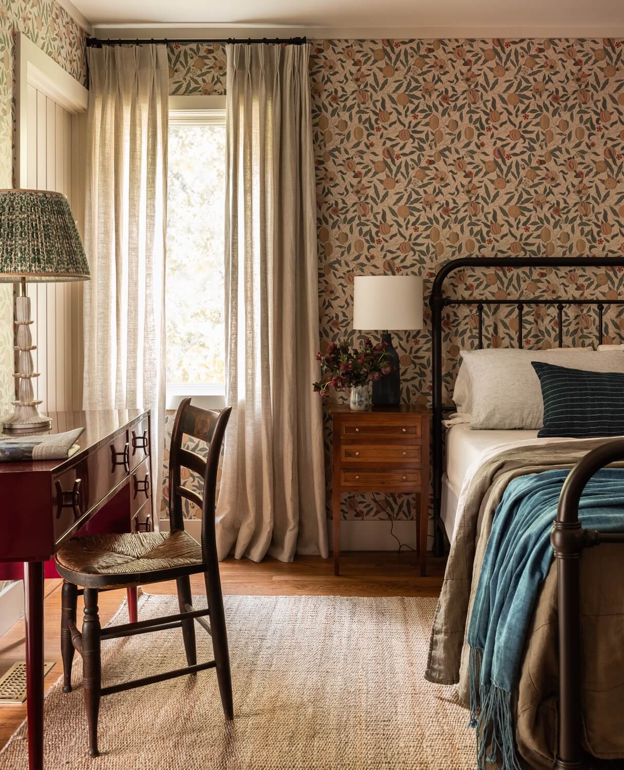 Best of 2022: Bedrooms 6 Heidi-Caillier-Design-CT-country-house-Dutchess-County-design-bedroom-william-morris-iron-bed-red-desk-vintage-wood-furniture-Nordroom