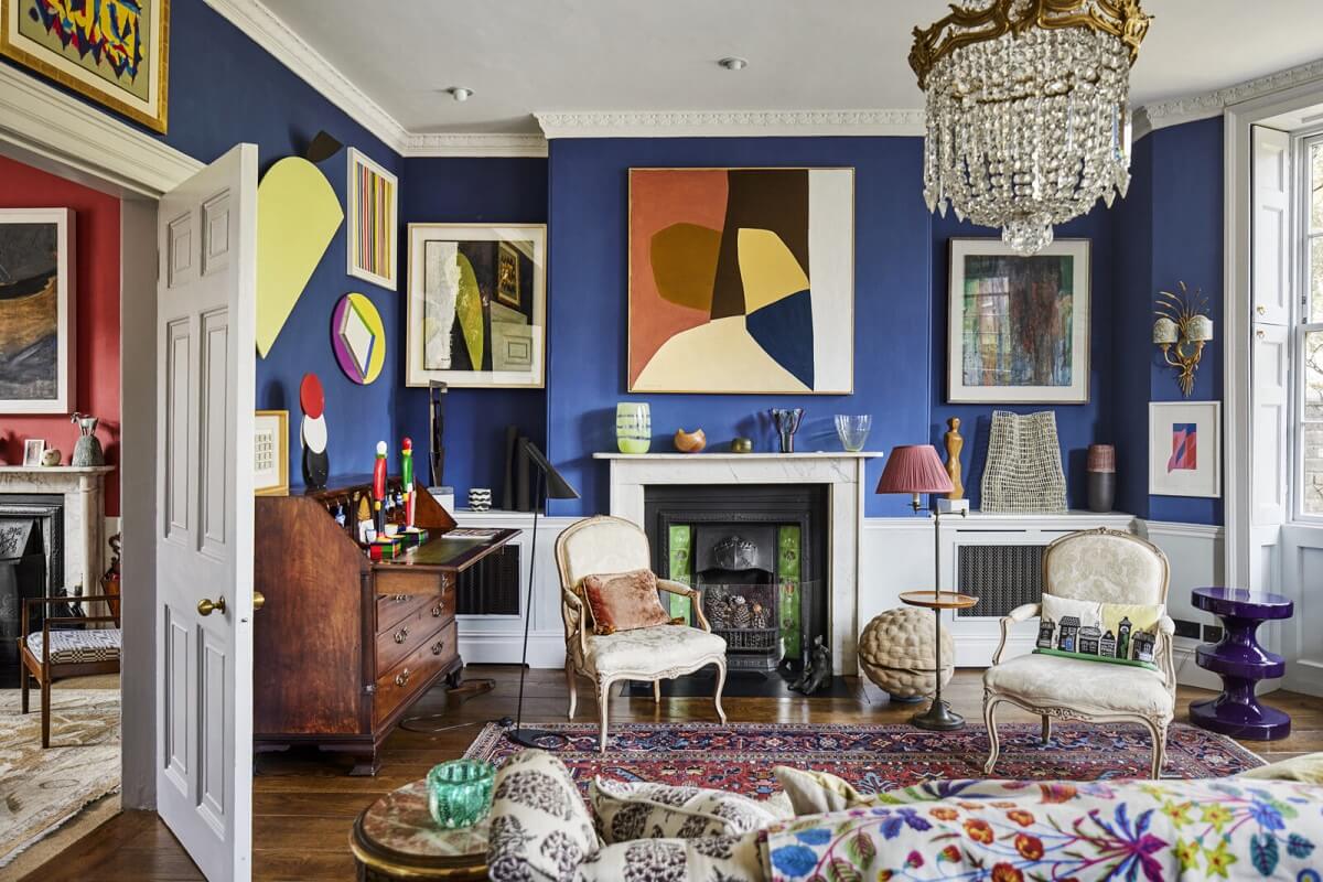 An Eclectic Art-Filled Townhouse in London 1 blue-eclectic-sitting-room-fireplace-art-pantone-very-peri-nordroom