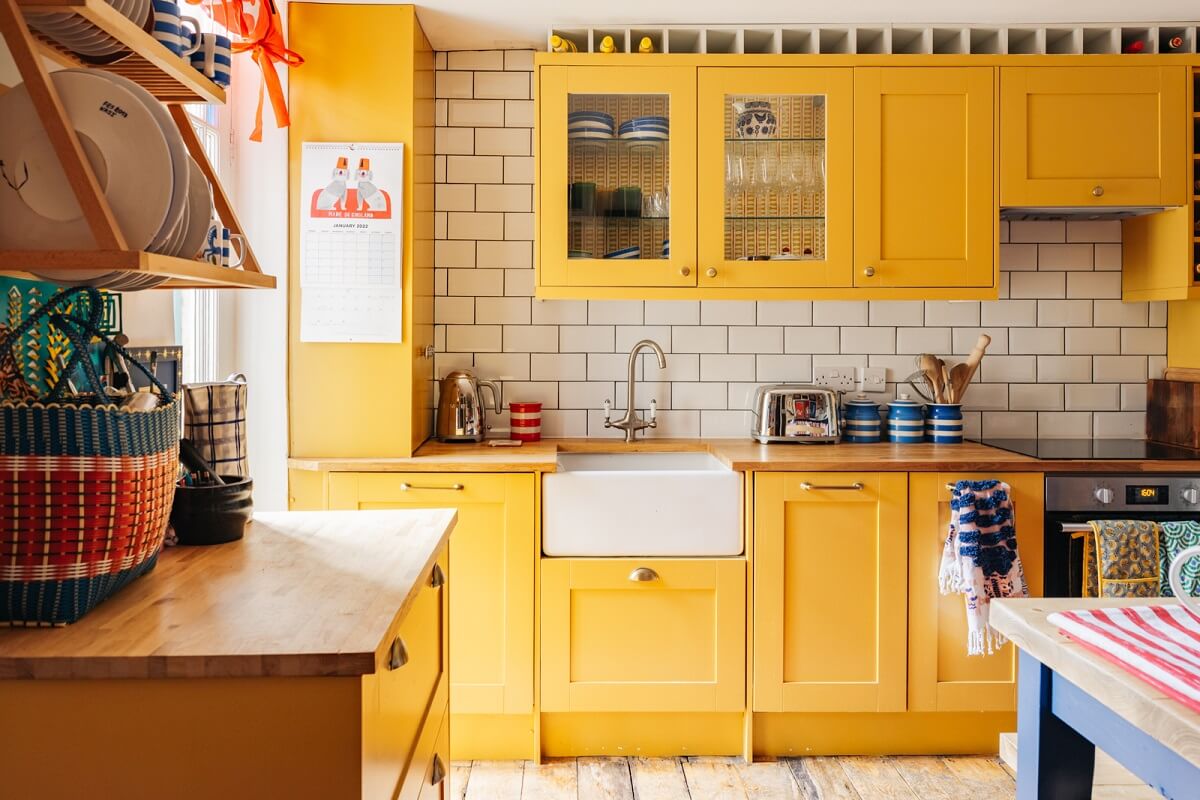 A Playful Maximalist Home in London 7 farrow-ball-india-yellow-kitchen-cabinets-maximalist-home-london-nordroom