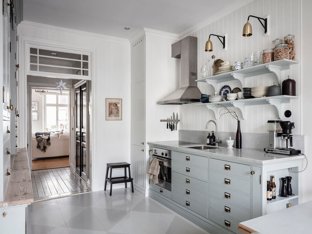 A Bright Nordic Home with Small (but Smartly Designed) Bedrooms 4 light-blue-kitchen-cabinets-open-shelves-nordroom