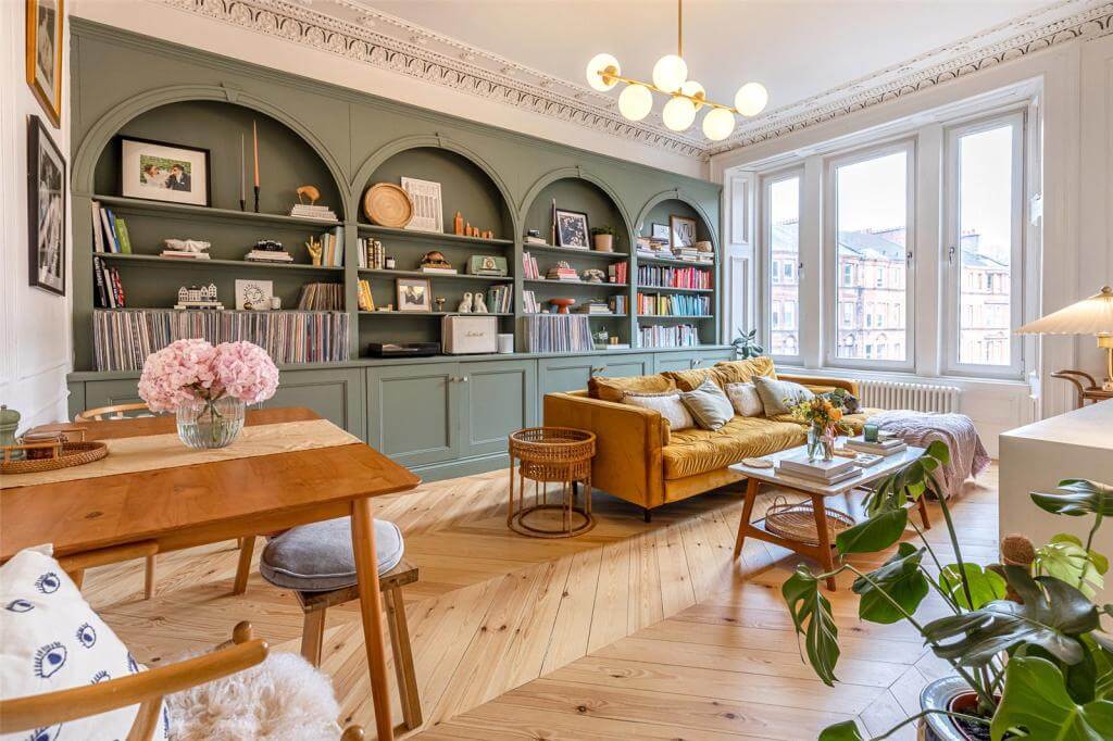 Kate Spiers Sells Her Beautiful Light Flat in Glasgow 1 living-room-custom-made-green-bookshelves-arches-wooden-floor-nordroom