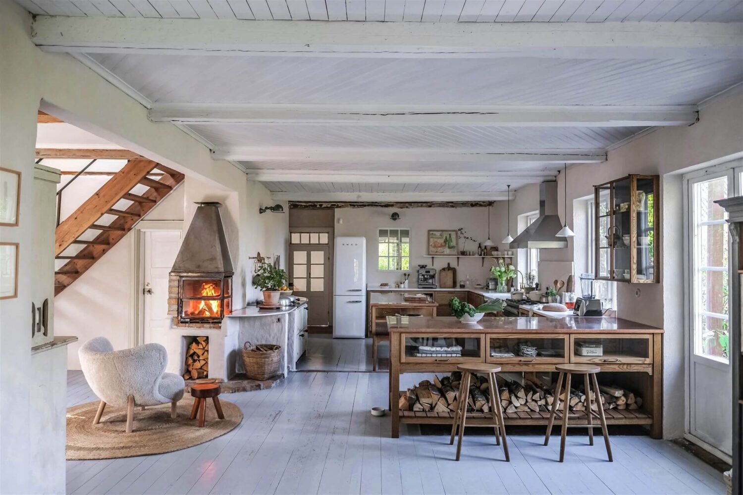 Best of 2022: Kitchens 6 open-plan-kitchen-devol-haberdasher-sitting-room-fireplace-countryside-home-our-food-stories-nordroom