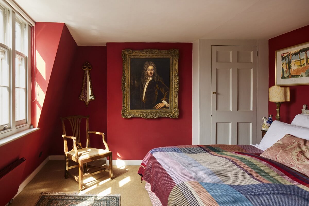 An Eclectic Art-Filled Townhouse in London 17 red-bedroom-portrait-painting-eclectic-london-home-nordroom
