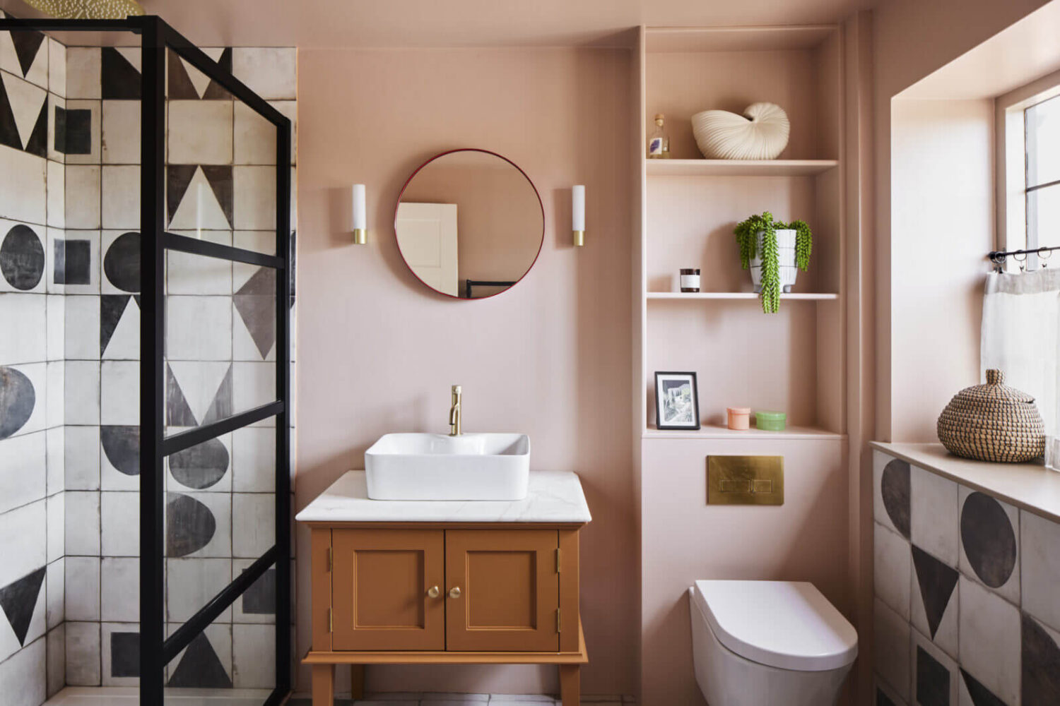 An Arts and Crafts House with Colorful Rooms 24 bathroom-pink-walls-black-white-tiles-shelves-above-toilet-nordroom