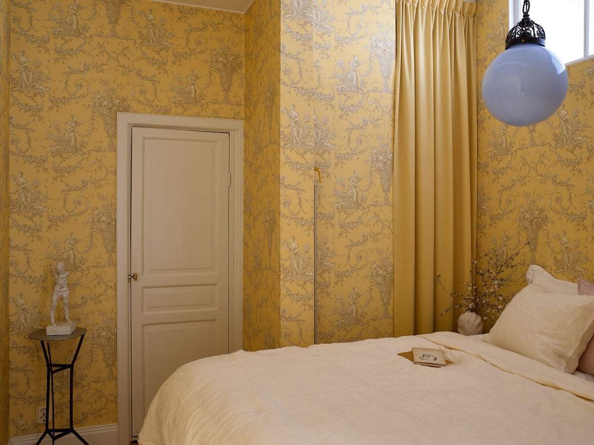 A Bedroom with Yellow French Wallpaper in a Small Scandi Home 11 bedroom-French-yellow-wallpaper-wardrobe-curtain-nordroom