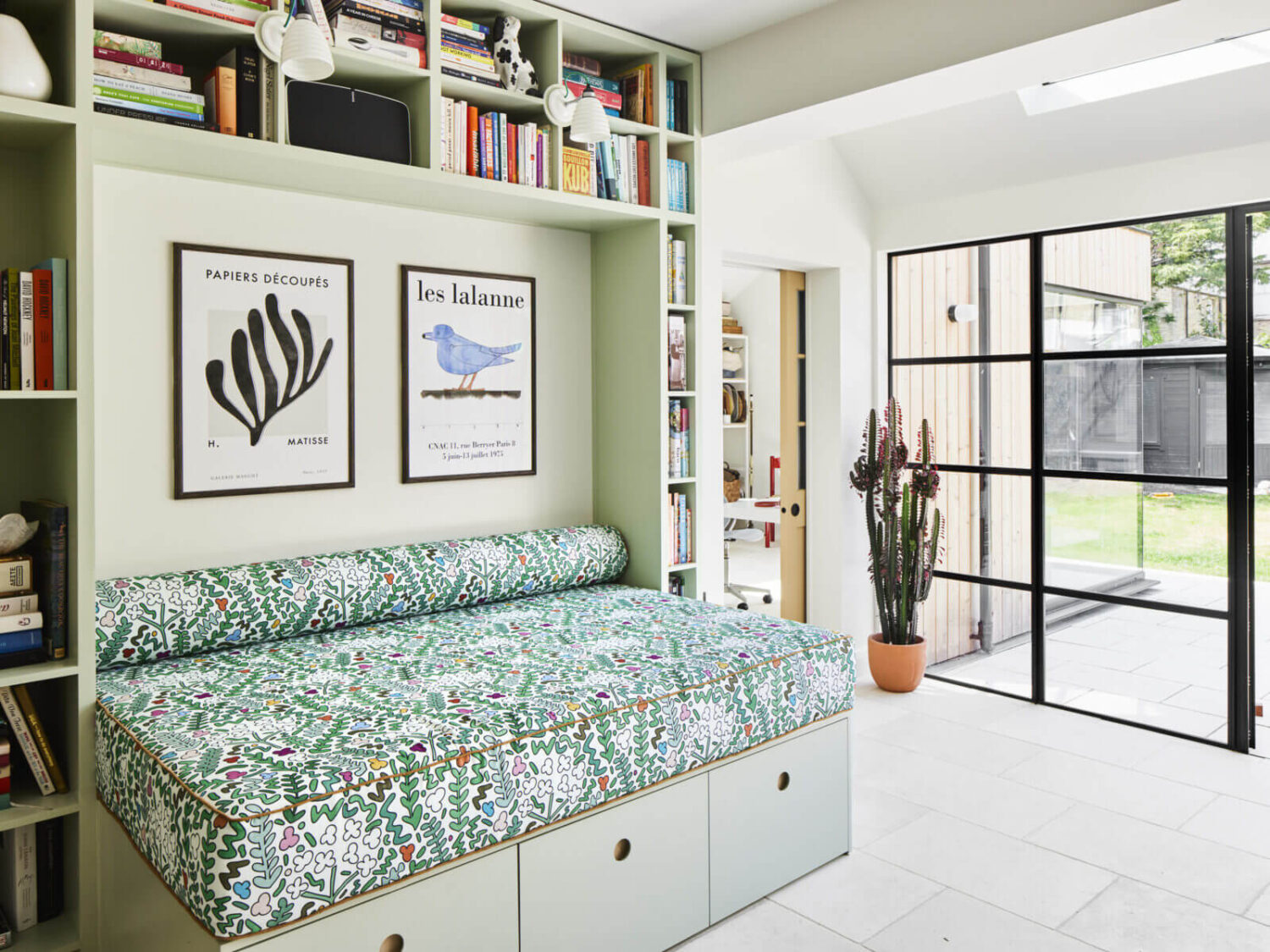 An Arts and Crafts House with Colorful Rooms 10 built-in-reading-nook-storage-bench-bookcase-nordroom