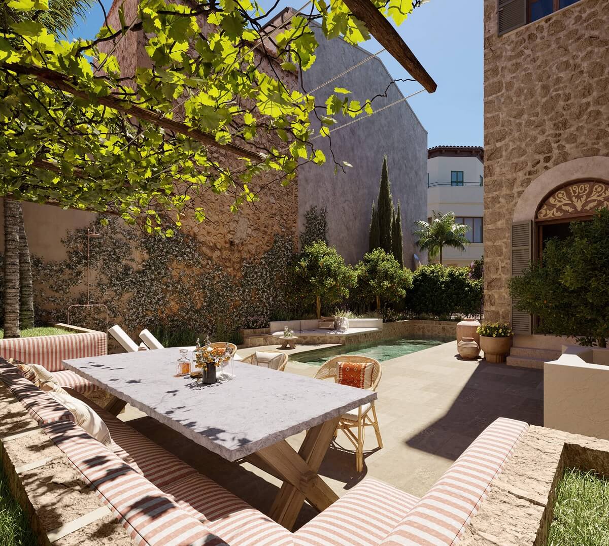 A Townhouse on Mallorca Combines Historic Charm and Modern Design 9 garden-built-in-seating-swimming-pool-townhouse-mallorca-nordroom