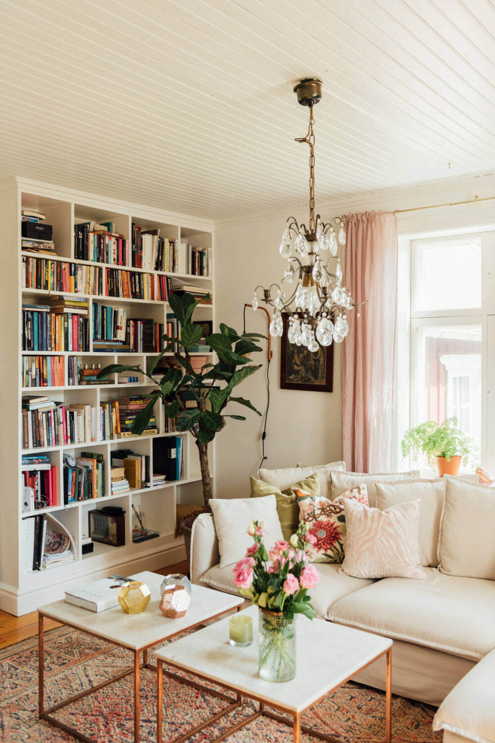A Vintage Bohemian Country House in Sweden 1 light-living-room-bookshelves-cozy-swedish-home-nordroom