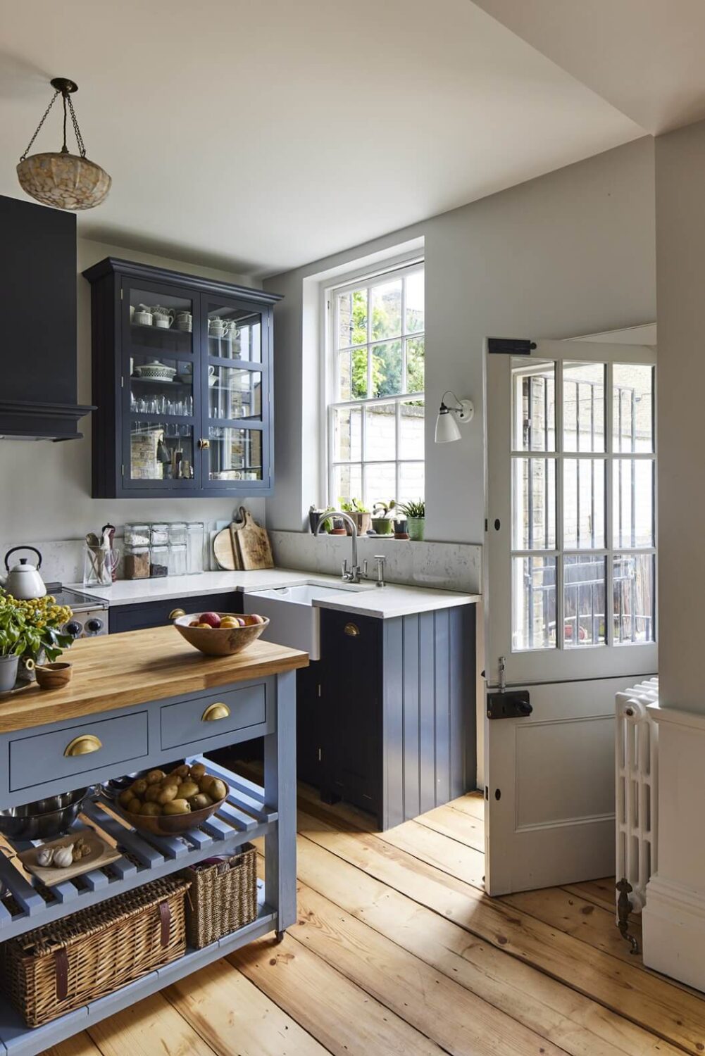 This Georgian Home in London Uses Blue as Accent Color 1 blue-kitchen-cabinets-wooden-floor-nordroom