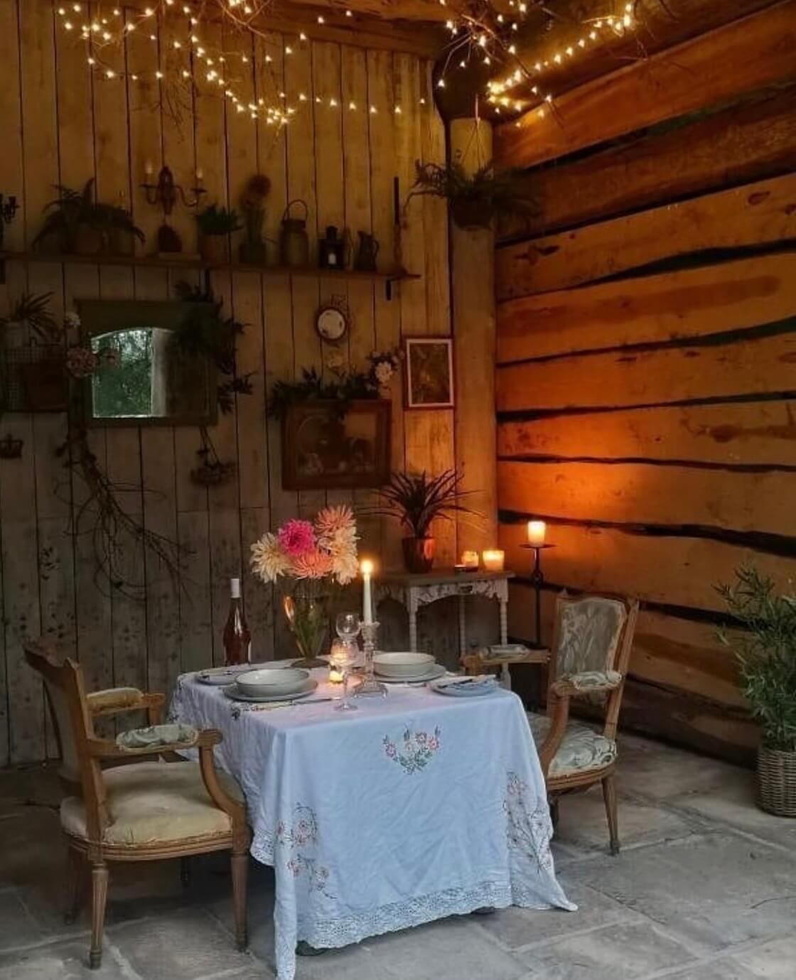 Best of 2022: Outdoor Spaces 21 cozy-outdoor-dining-space-log-house-nordroom