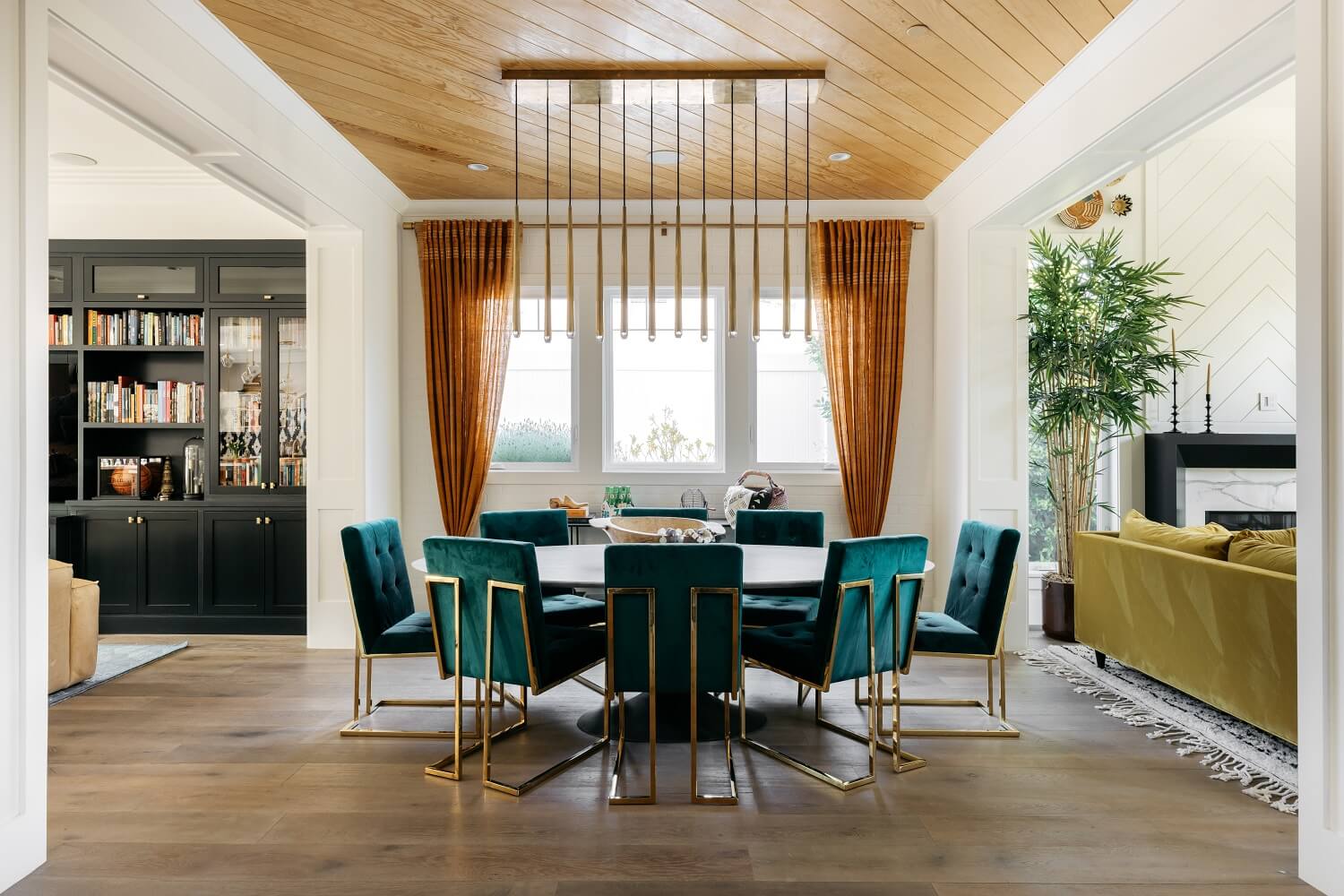 The Los Angeles Home of Emmy Raver-Lampman and Daveed Diggs 10 round-dining-table-green-velvet-chairs-daveed-diggs-emmy-raver-lampman-nordroom