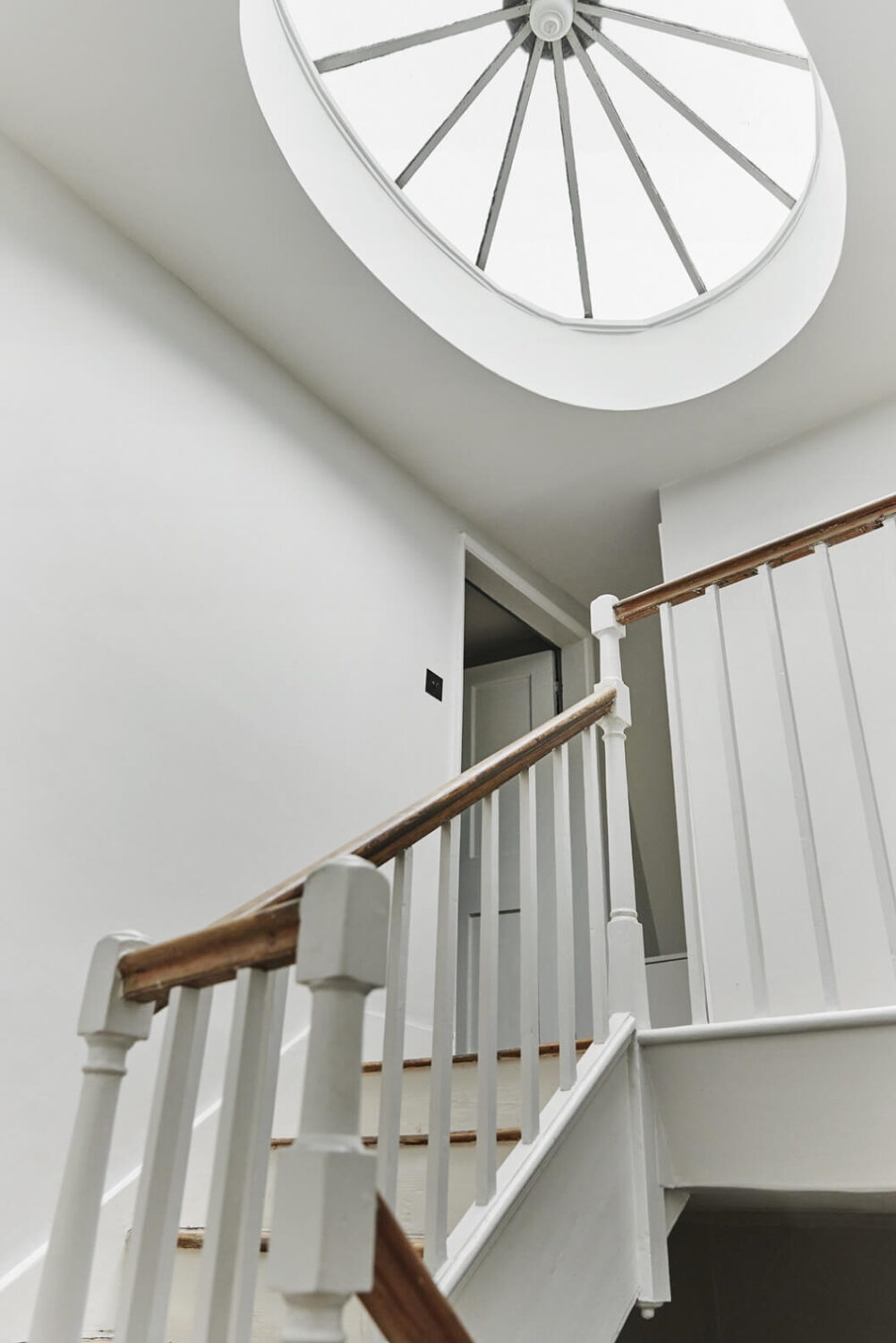 This Georgian Home in London Uses Blue as Accent Color 17 staircase-georgian-home-skylight-nordroom