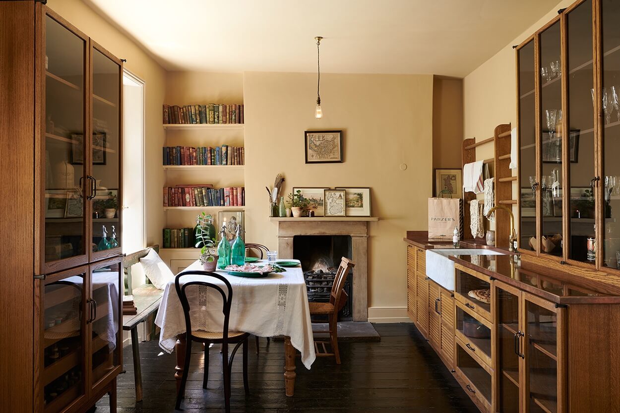 Color of the Year 2025 Prediction (with Color Palettes) 25 devol-haberdasher-kitchen-warm-yellow-walls-fireplace-nordroom