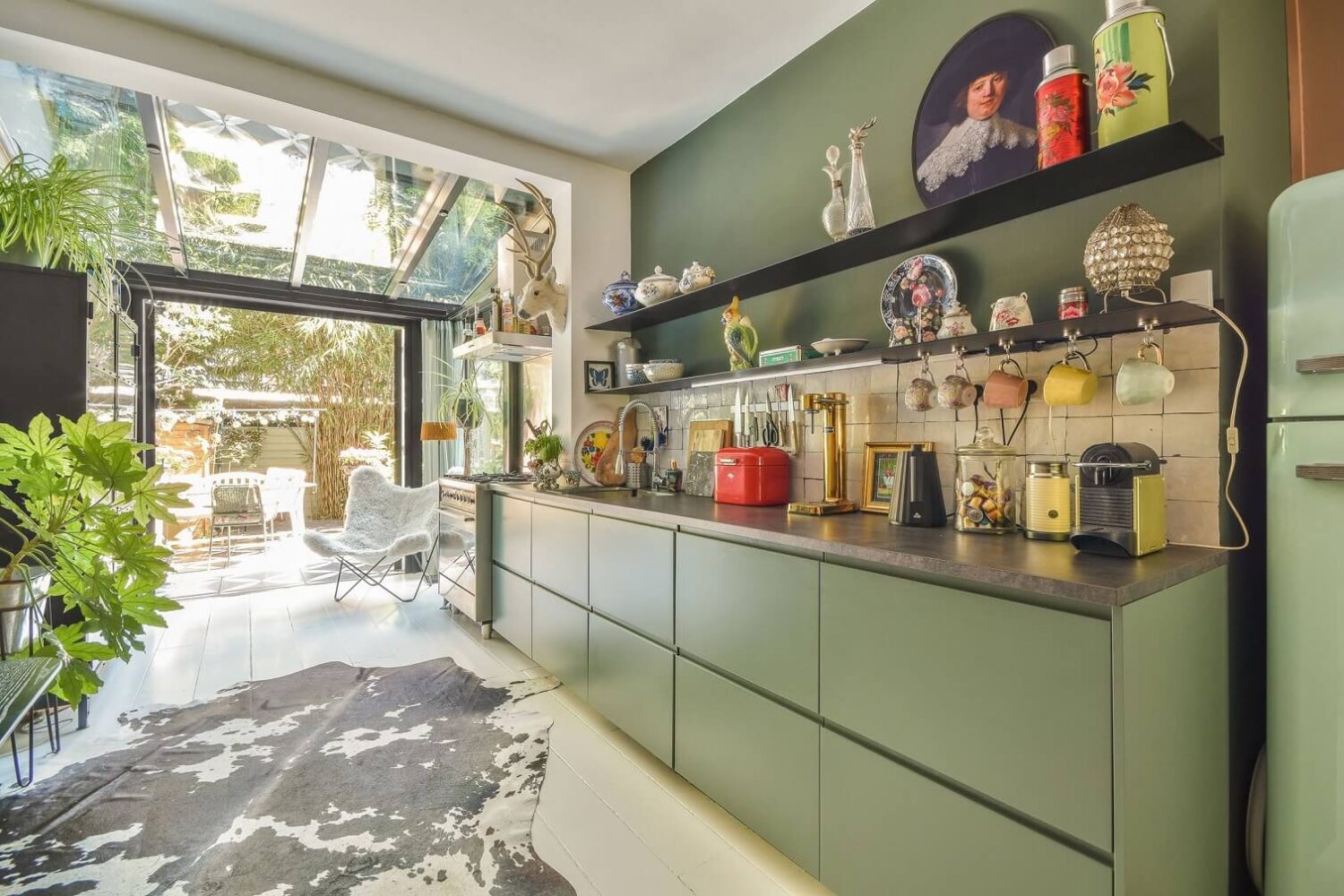 A Bright Colorful Home in Amsterdam 6 green-kitchen-cabinets-open-shelf-colorful-home-amsterdam-nordroom