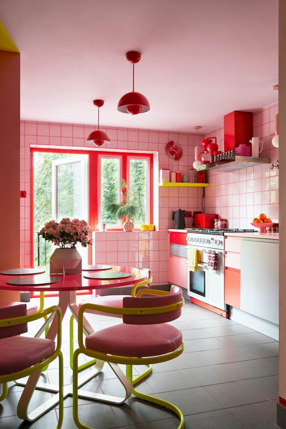A Quirky London Home Decorated with Neon Colors 1 pink-kitchen-round-dining-table-nordroom