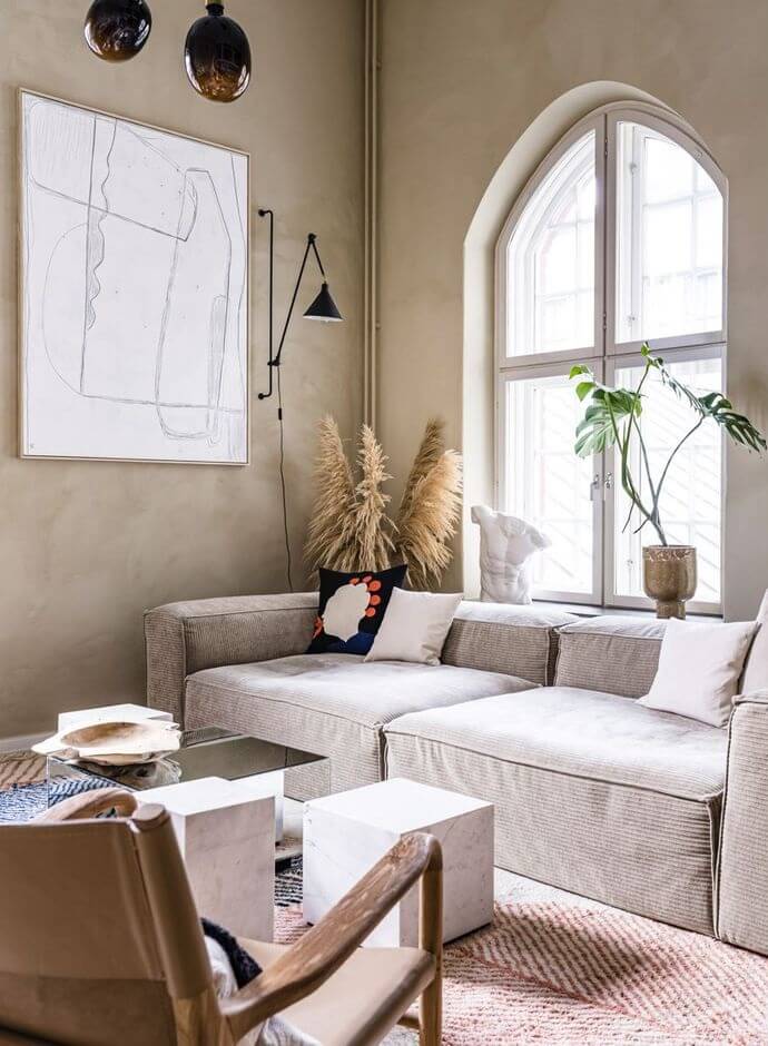 A Historic Factory Transformed Into A Stylish Home 3 living-room-beige-walls-arched-windows-nordic-design-nordroom