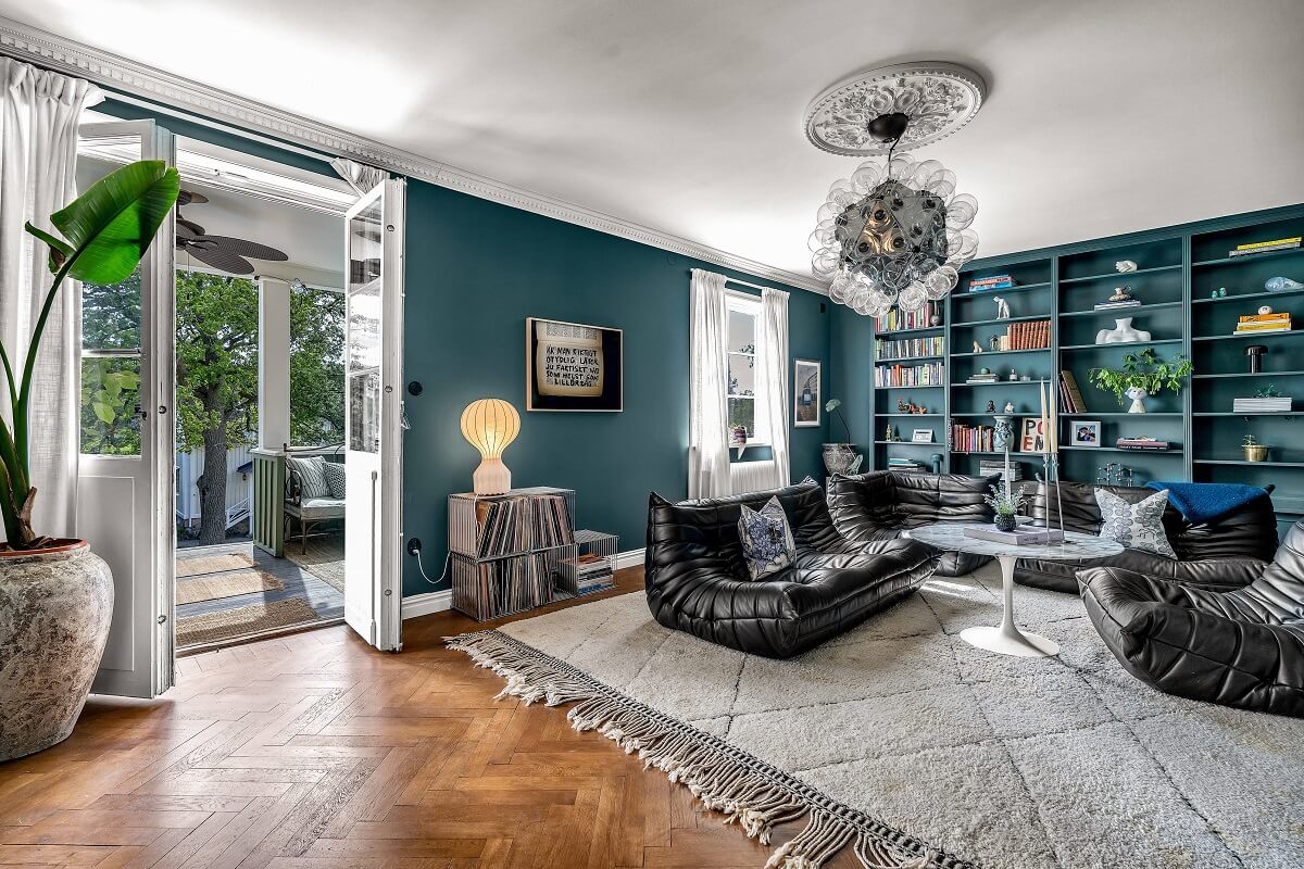 Bold Colors in a 1920s Villa in Sweden 1 living-room-teal-green-walls-bookshelves-togo-chairs-nordroom