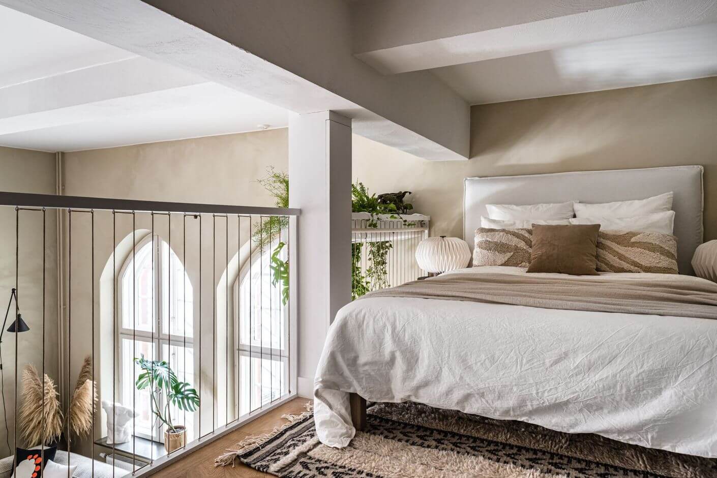 A Historic Factory Transformed Into A Stylish Home 16 loft-bedroom-beige-walls-nordic-design-nordroom