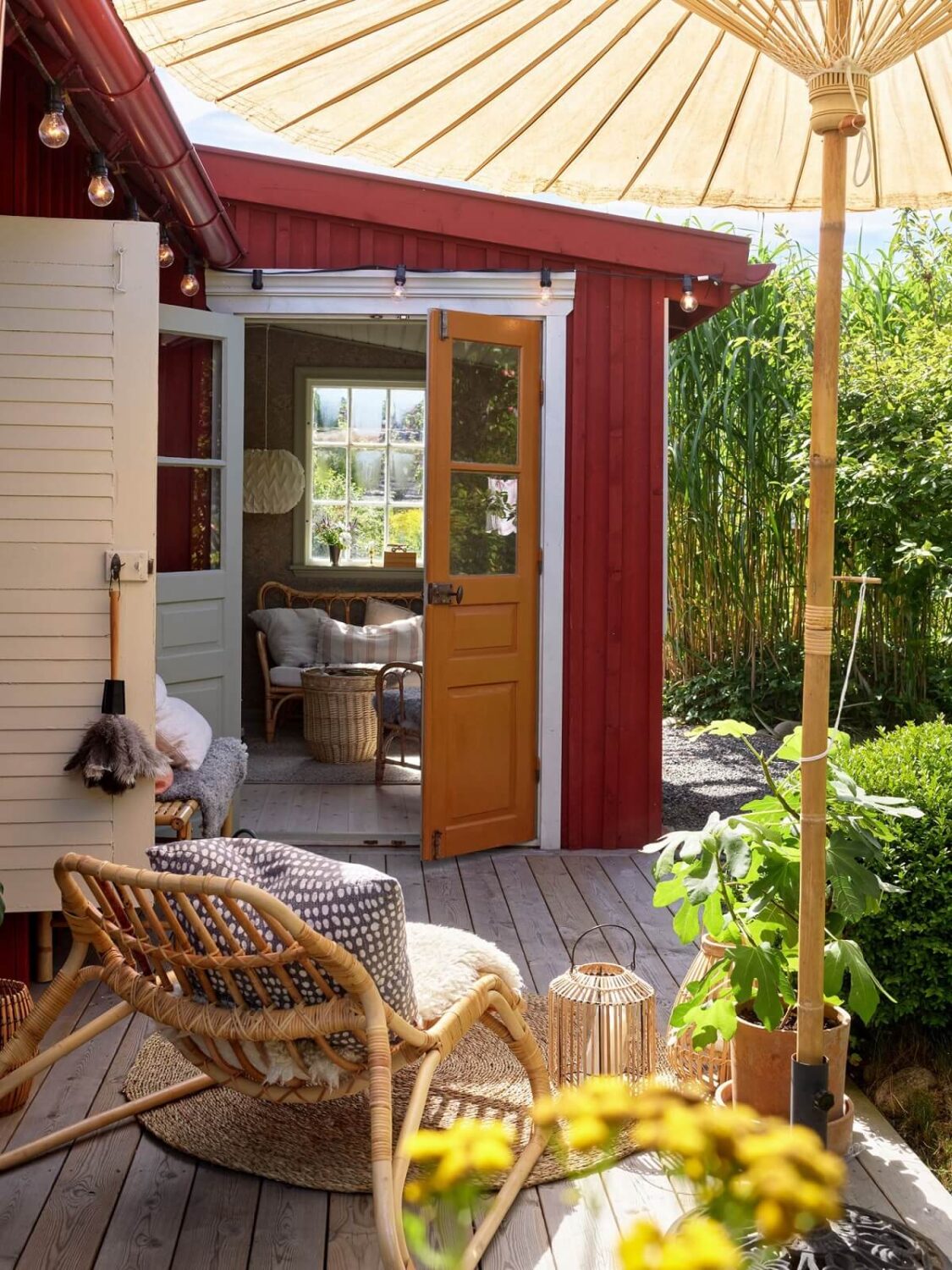 A Cozy Renovated Cottage on a Swedish Allotment 24 outdoor-terrace-red-cottage-sweden-nordroom