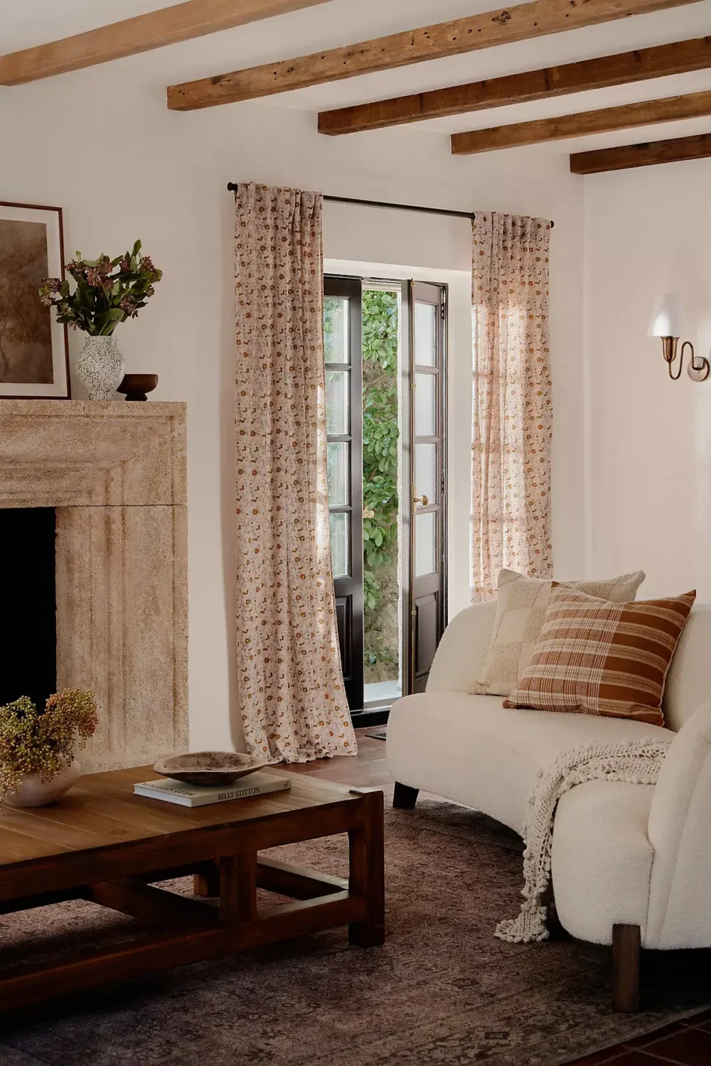 A Warm Fall Home by Amber Lewis for Anthropologie 1 sitting-room-earthy-color-accents-wooden-beams-fireplace-nordroom