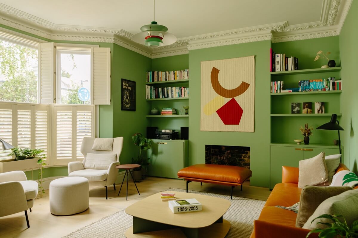 A London Home with a Cheerful Green Sitting Room 1 living-room-green-walls-fireplace-bay-window-built-in-bookshelves-nordroom