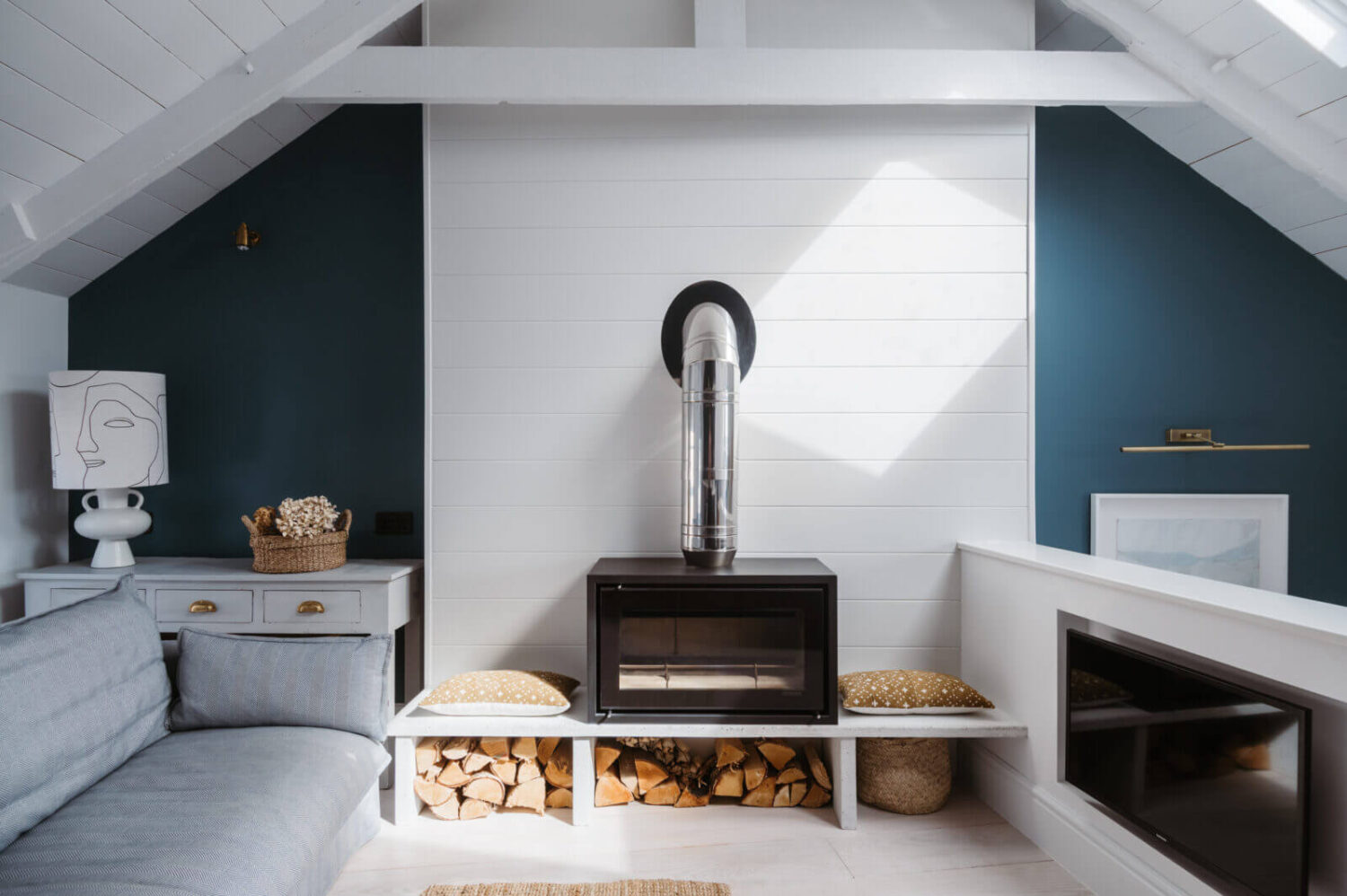 A Beautiful Duplex Apartment in Cornwall 4 small-sitting-room-woodburner-blue-walls-nordroom