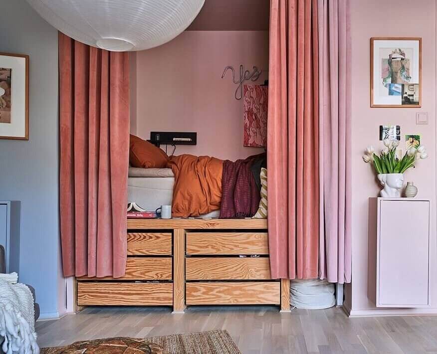 53 Studio Apartments with a Curtain Room Divider 13 colorful-bed-nook-pink-curtains-storage-bed-nordroom