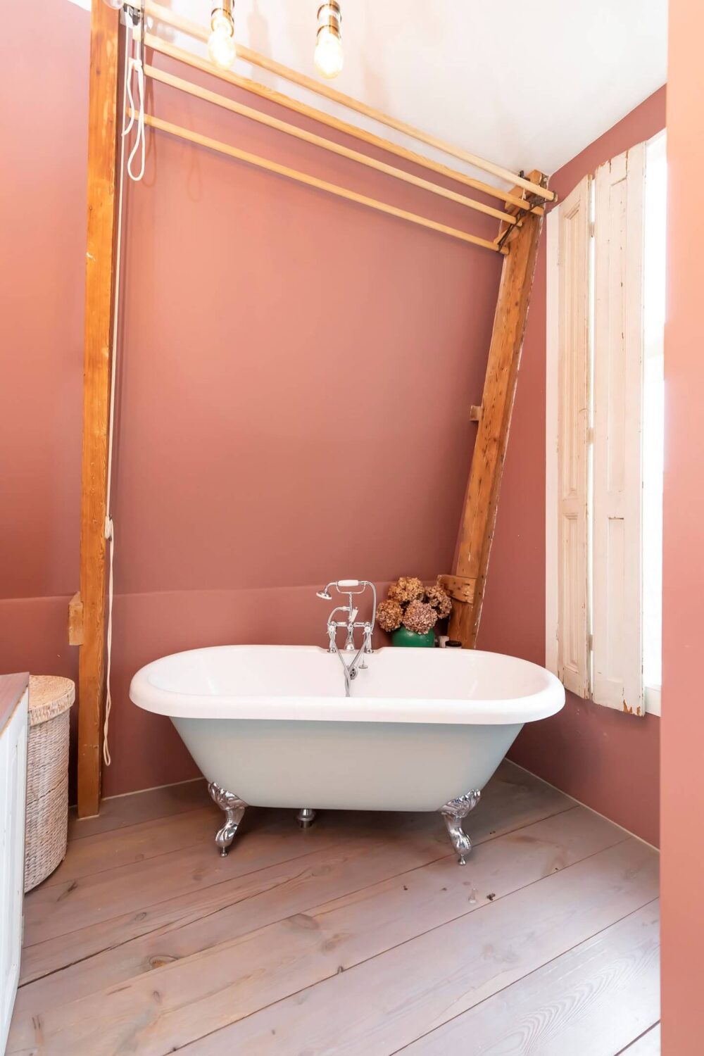 A Colorful Loft in Amsterdam with Exposed Wooden Beams 18 bathroom-freestanding-bath-earthy-pink-walls-nordroom