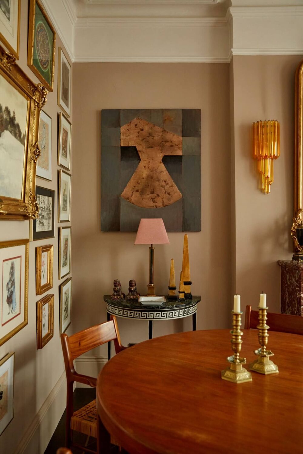 7 Simple Tricks To Make a Low Ceiling Look Taller 2 dining-area-round-wooden-table-gallery-wall-nordroom