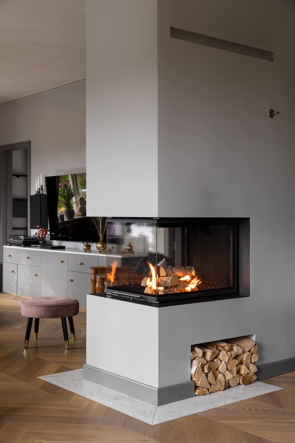 A Scandinavian Home with Purple Color Accents 11 fireplace-divider-living-room-kitchen-bedroom