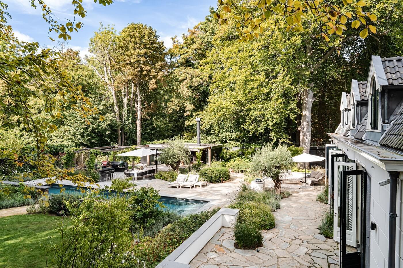 Best of 2022: Outdoor Spaces 12 garden-pool-trees-dutch-carriage-house-nordroom