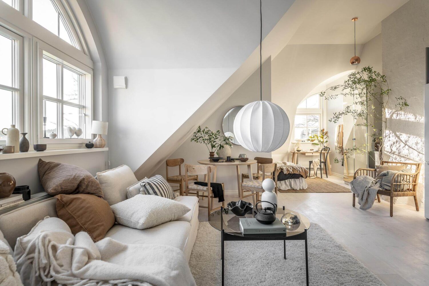 A Small Scandinavian Loft with Beautiful Natural Light 1 light-scandinavian-loft-seating-area-slanted-walls-nordroom