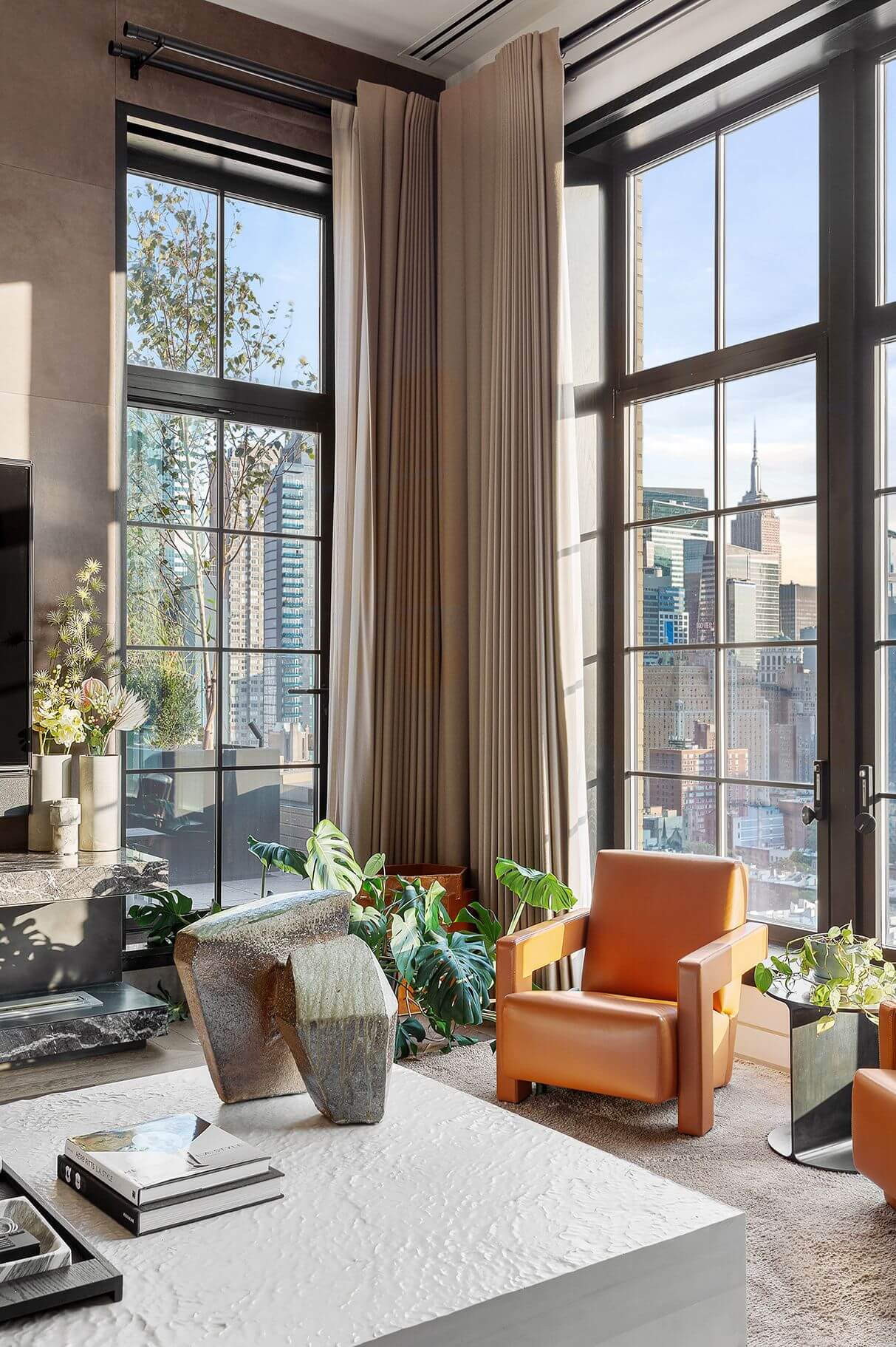 living-room-floor-to-ceiling-windows-manhattan-penthouse-trevor-noah-nordroom