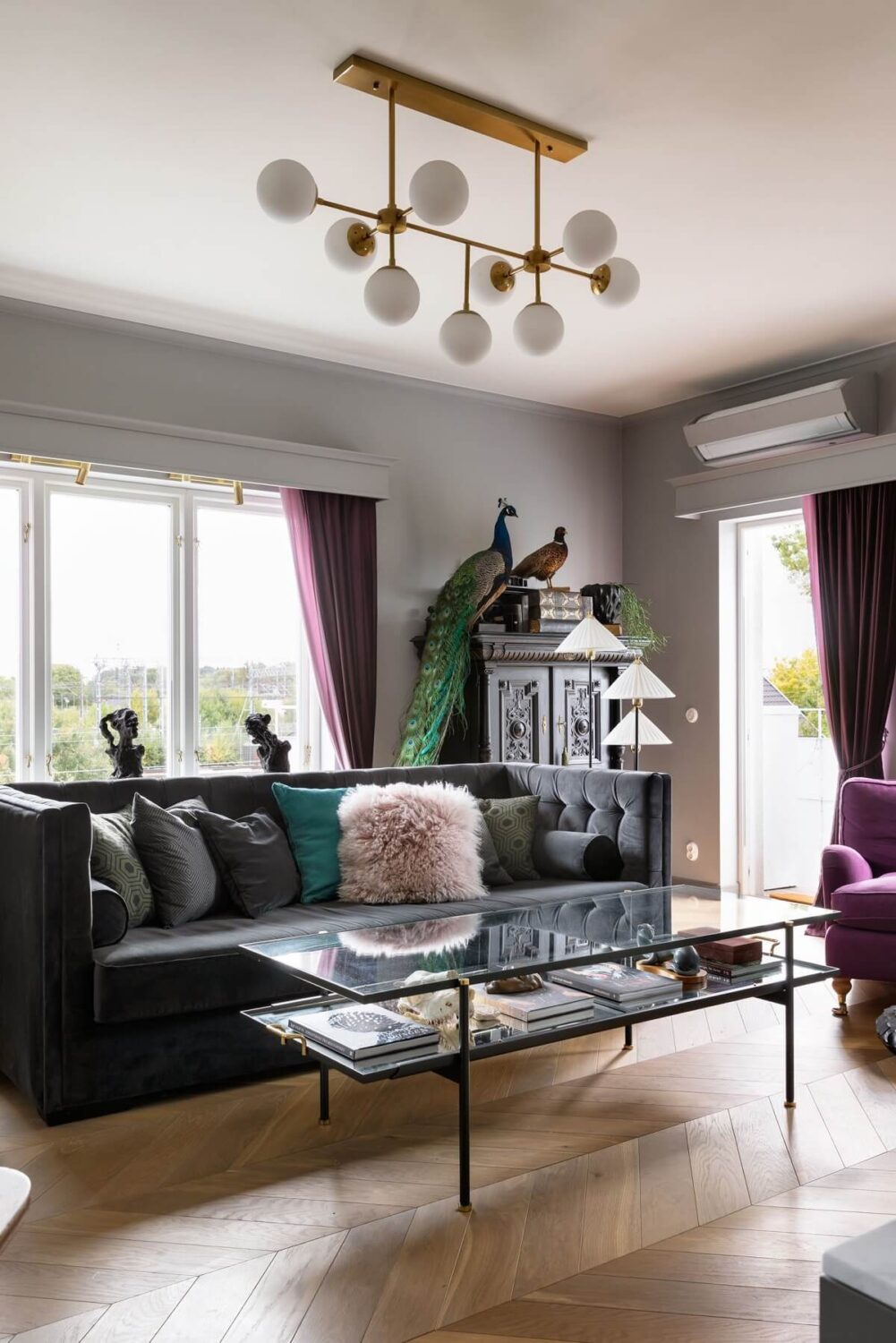 A Scandinavian Home with Purple Color Accents 4 living-room-gray-walls-purple-curtains-nordroom