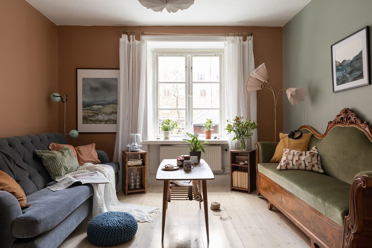A Cozy Apartment Painted in Warm Natural Colors 1 sitting-room-antique-couch-warm-natural-colors-nordroom